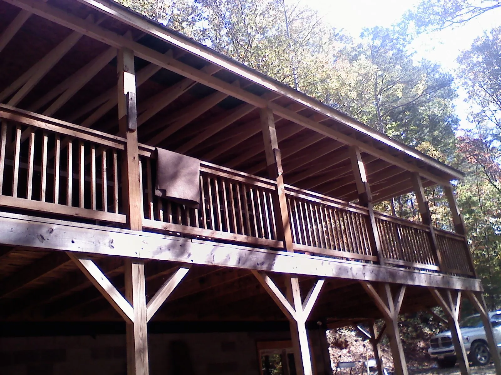 Timber framing under a new elevated porch and deck in Hiwassee